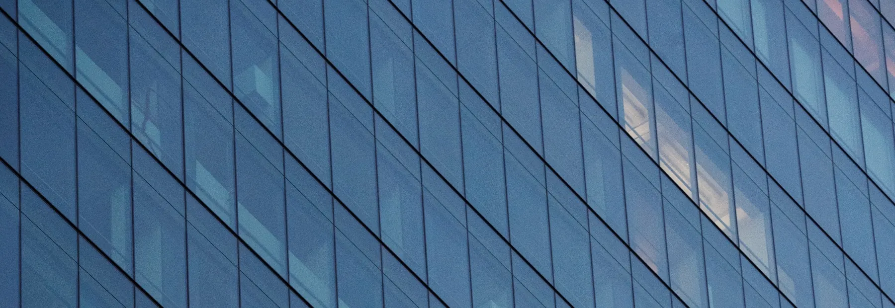 Glass curtain-wall facade of a commercial office building